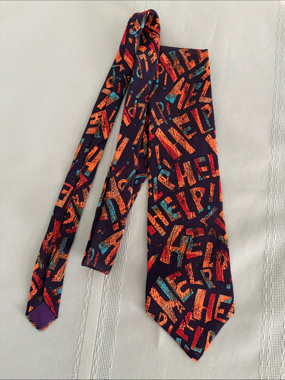 Navy Tie with Orange and Teal Graphic Lettering